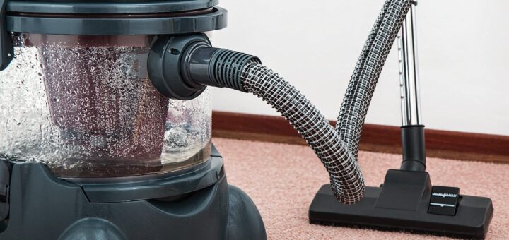 Black and Red Canister Vacuum Cleaner on Floor