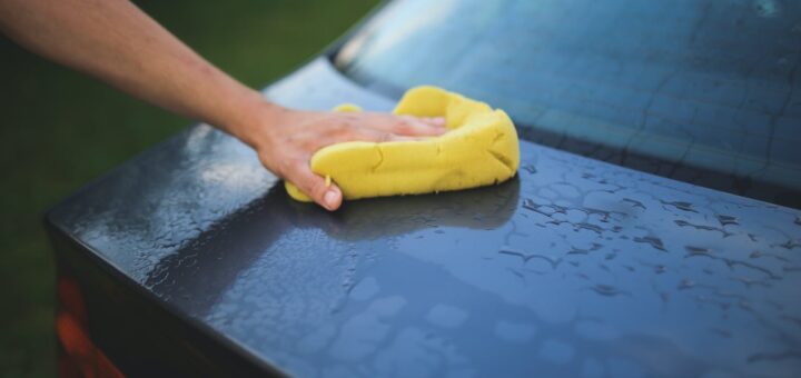 Washing a car with a sponge