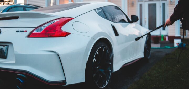 white porsche 911 parked near white house